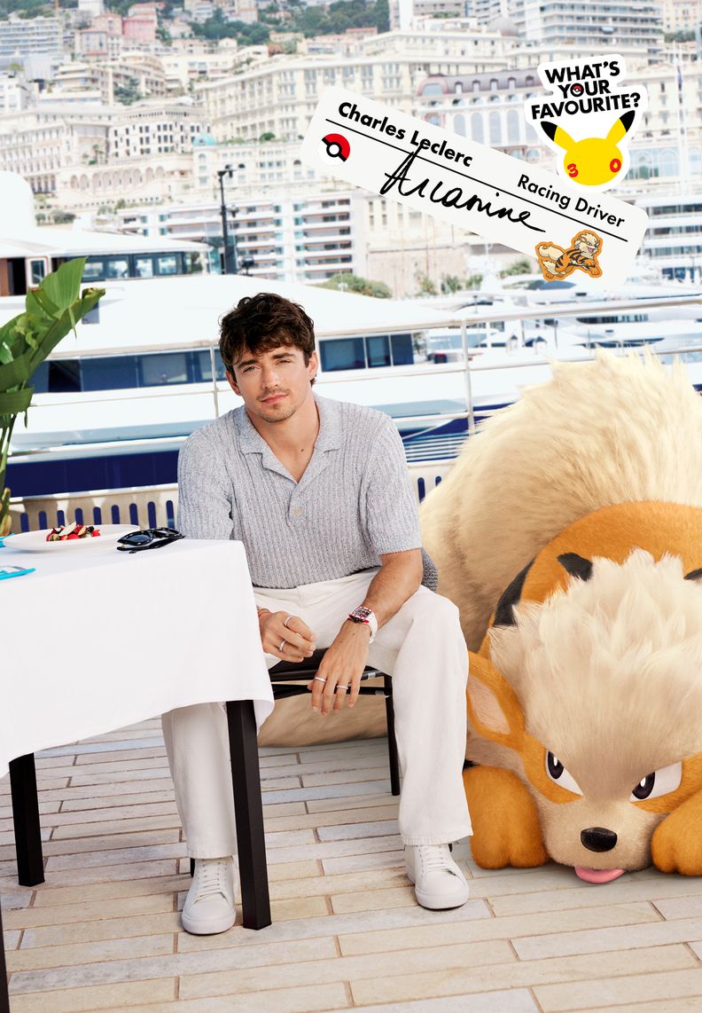 Racing driver Charles Leclerc sits outside a restaurant in a harbor with Arcanine resting beside him.